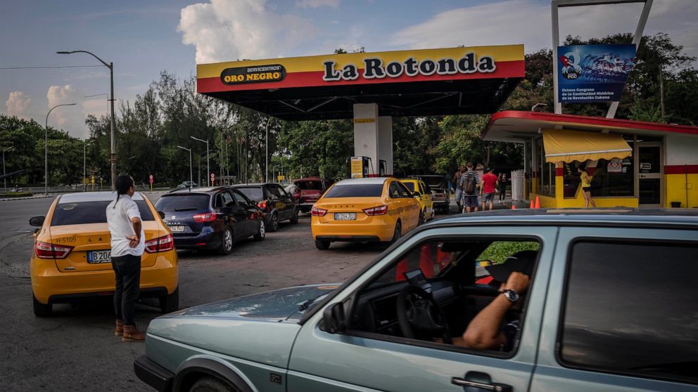 Drivers wait their turn to fuel their vehicles at a gas station in Havana, Cuba, Thursday, July 14, 2022. (AP Photo/Ramon Espinosa)